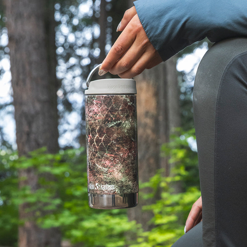 12oz-tkwide-with-cafe-cap-mossy-oak-h3 12oz_tumbler_mossyoak_rainbowtrout_hand_closeup_square.jpg