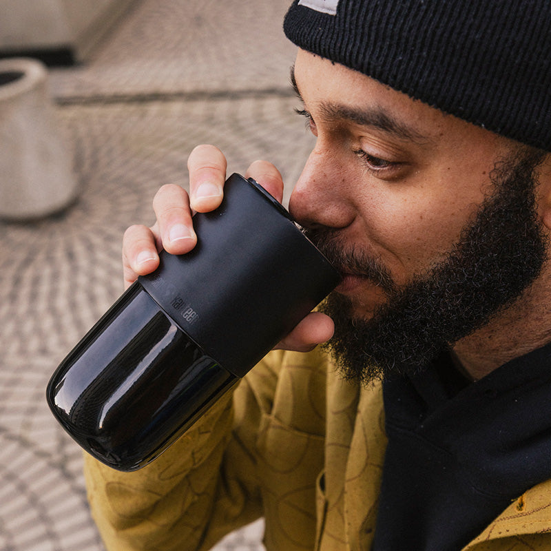 daily-on-the-go-set-f4 16oz_rise_tumbler_black_man_drink_square.jpg