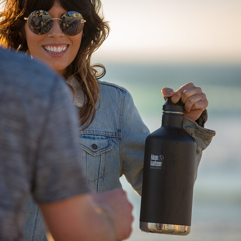 64oz-classic-with-loop-cap-z5 64oz_insulated_classic_black_beach_girl_hand_square.jpg
